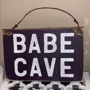 purple babe cave sign